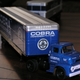 Illustration for article titled Hot Sixty 4th: M2 Ford C-500 COE Shelby Cobra Trailer